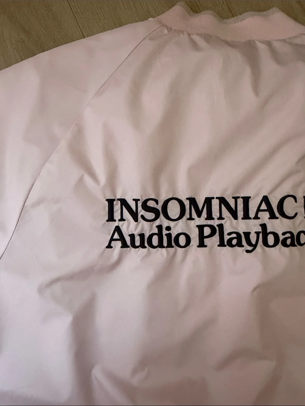 Insomniac LTD Audio Playback Light Pink Bomber Jacket with Embroidered Logo